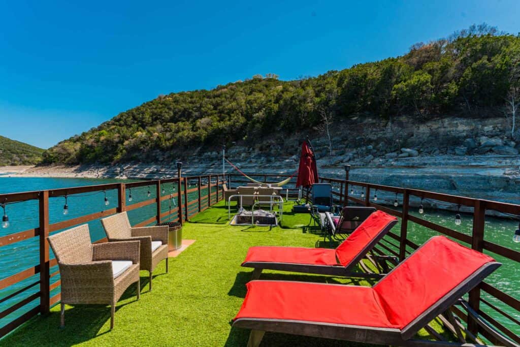 Houseboat upper deck with lounging chairs