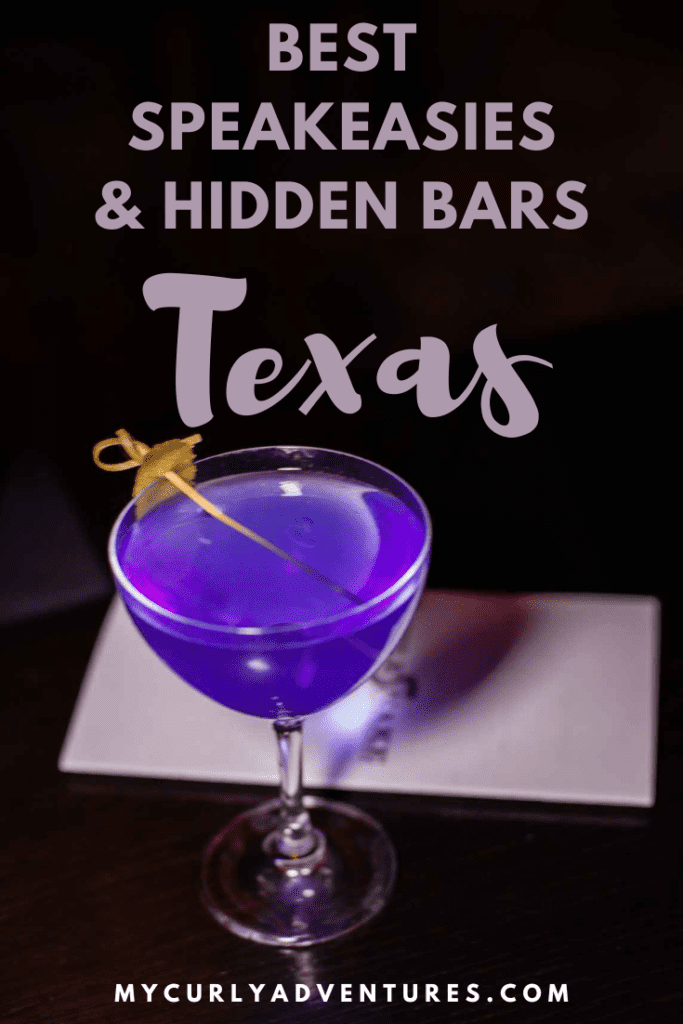 Purple cocktail in a dark speakeasy in DFW