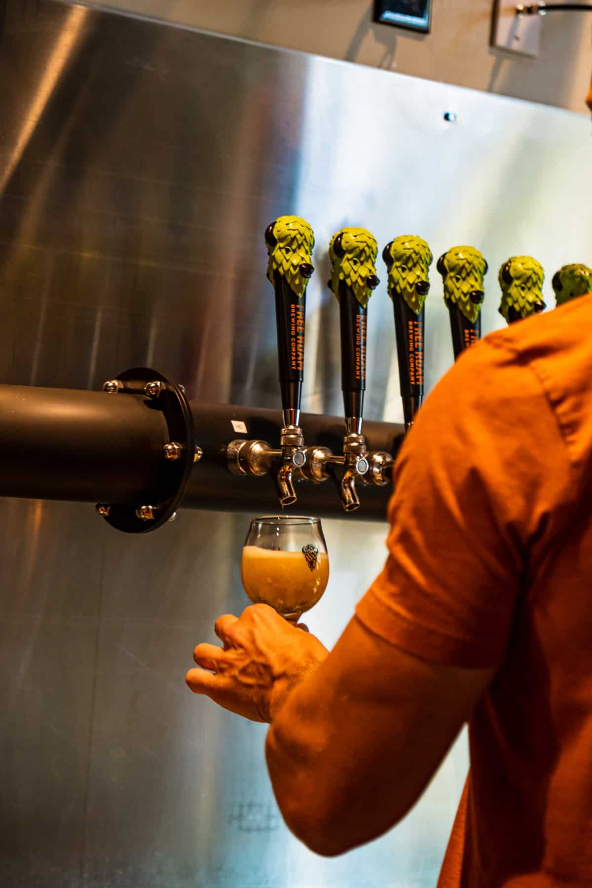 Bar Tender Refilling a Cocktail Glass