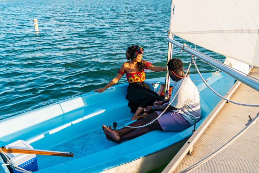 Couple riding a sailing boat