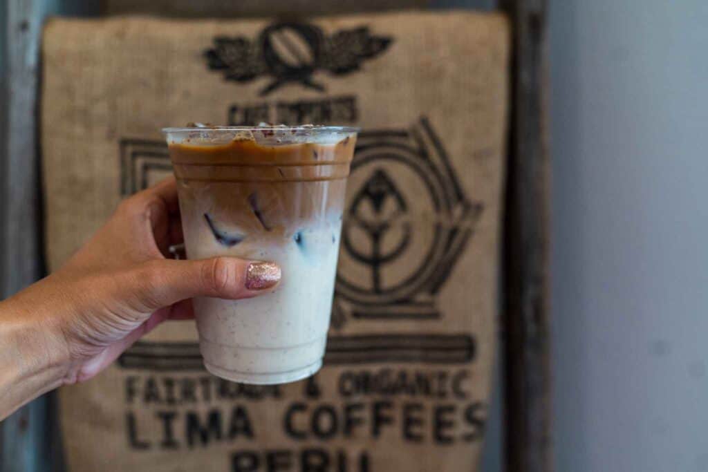 Hand Holding a Cup of Coffee