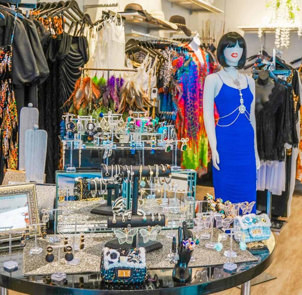 a mannenquinin a store with a display of jewelry