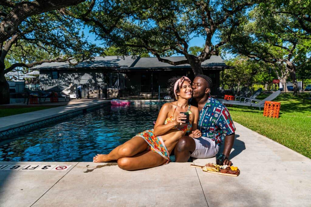 Couple By the Pool with Charcuterie board at the side