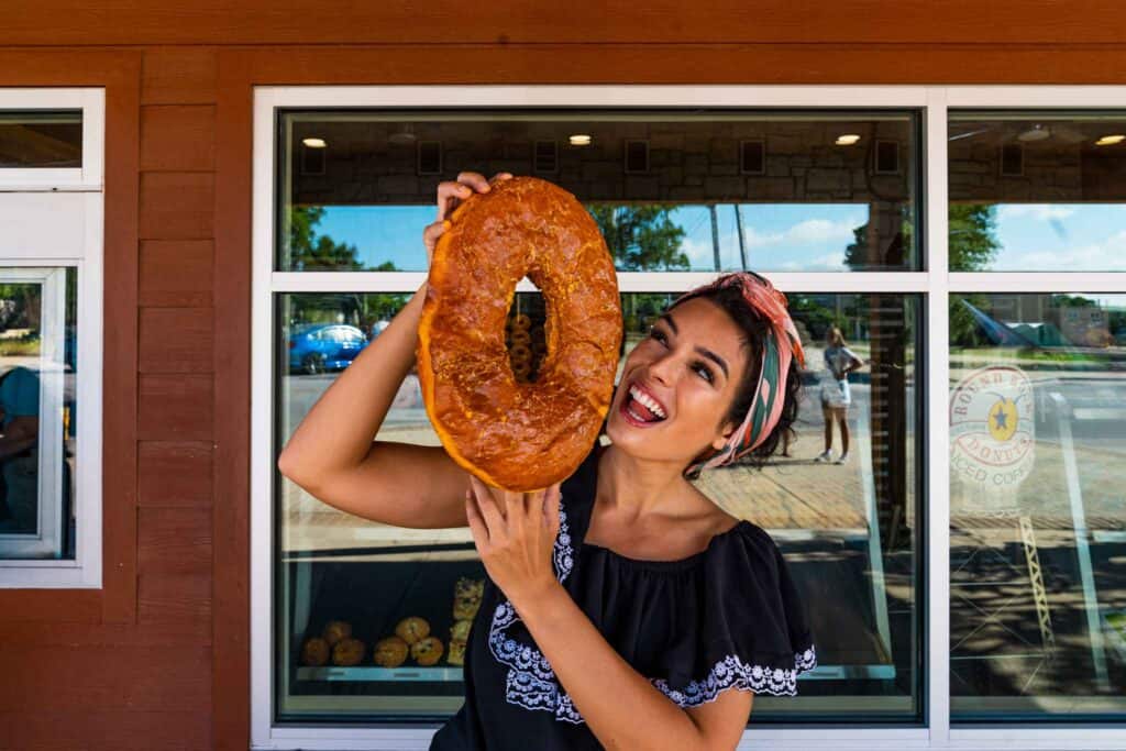 Lady holding a giant donut