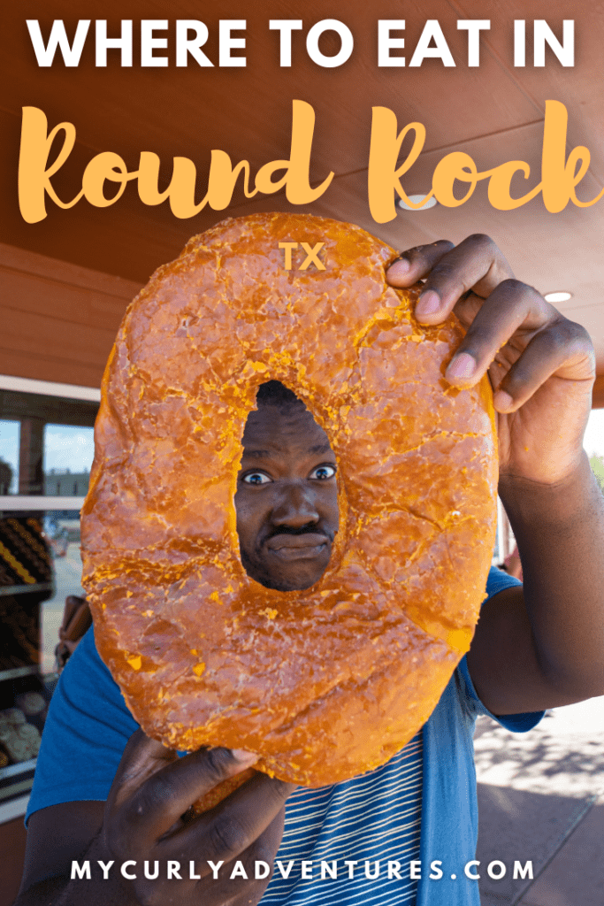 Man holding a giant donut