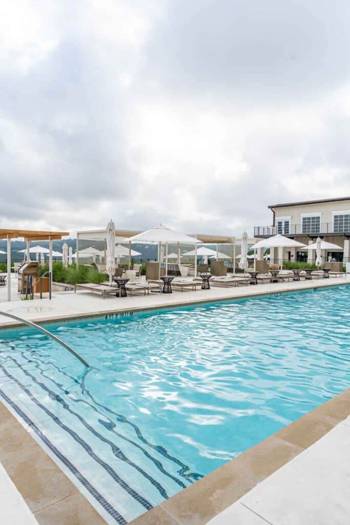 Outdoor Pool with Lounging Areas at the side