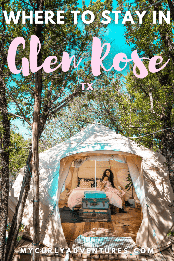 Lady sitting on the bed of a glamping tent