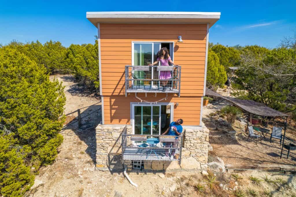 Couple by the first and 2nd story terrace of the La Tour accomodation