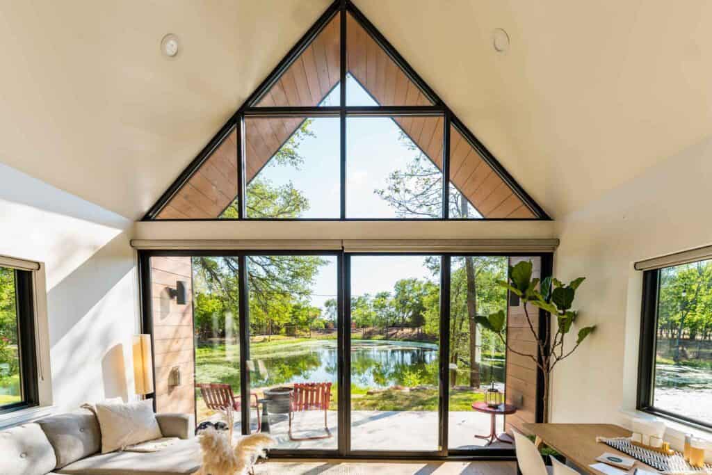 floor-to-ceiling windows in the living room that overlook the lake
