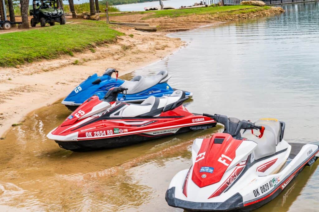 Jet skis parked on the beach