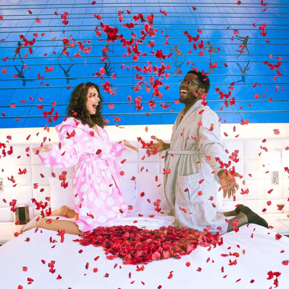 Couple throwing rose petals
