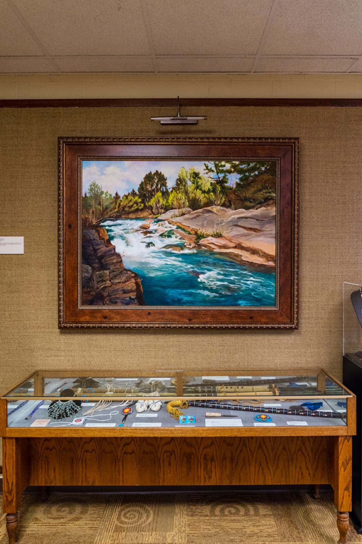 Framed artwork and artifacts on display