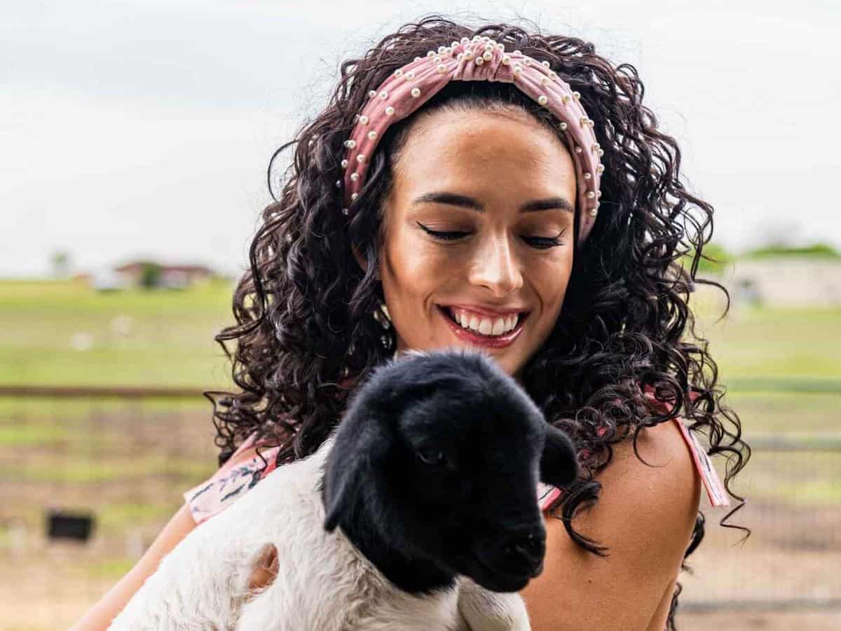 Lady holding a Baby Goat