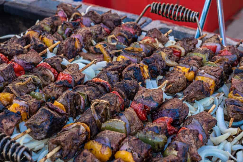 Beef skewers on a bed of onions