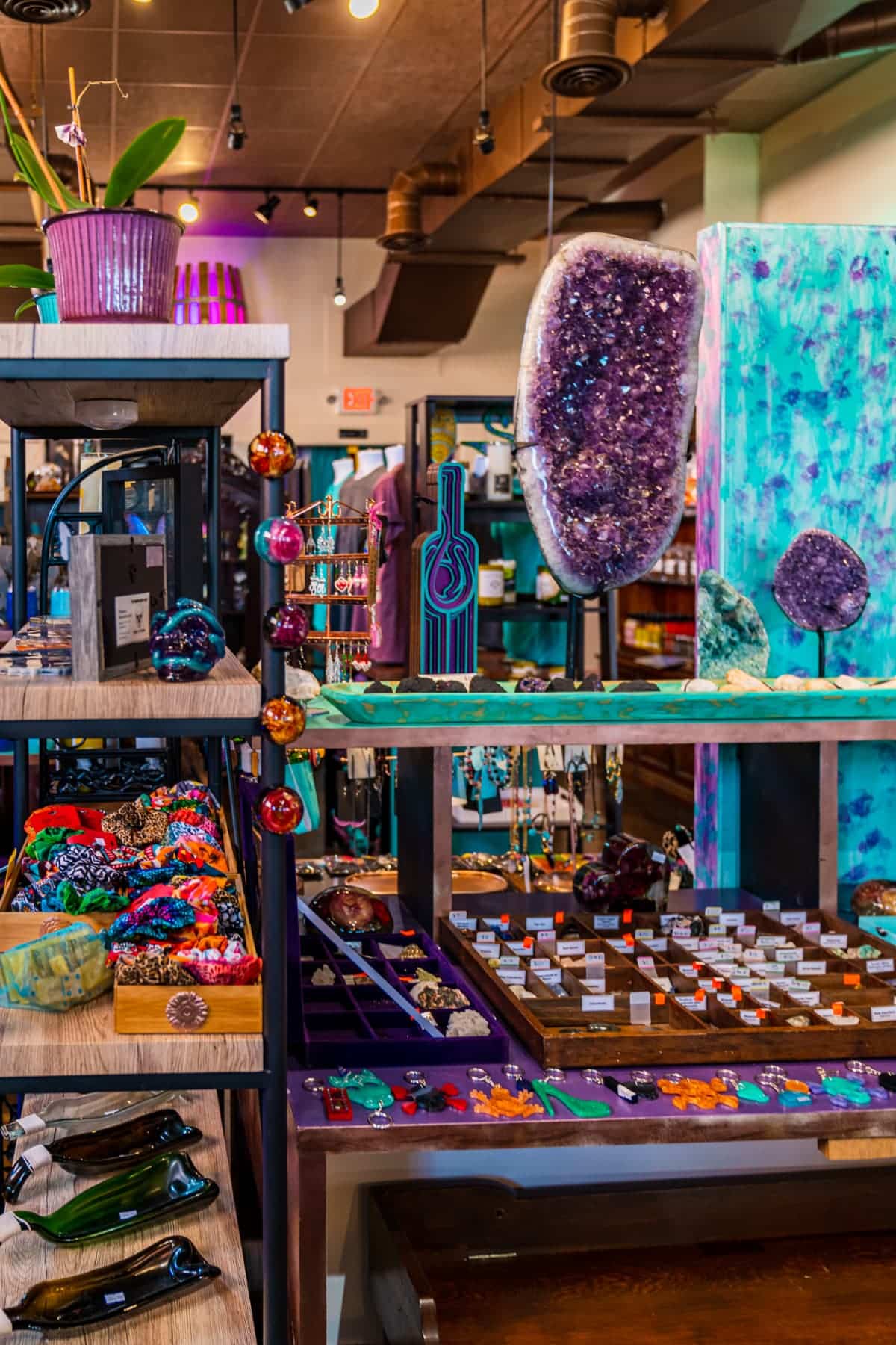 Shelves filled with crystals, jewelry, and other accessories