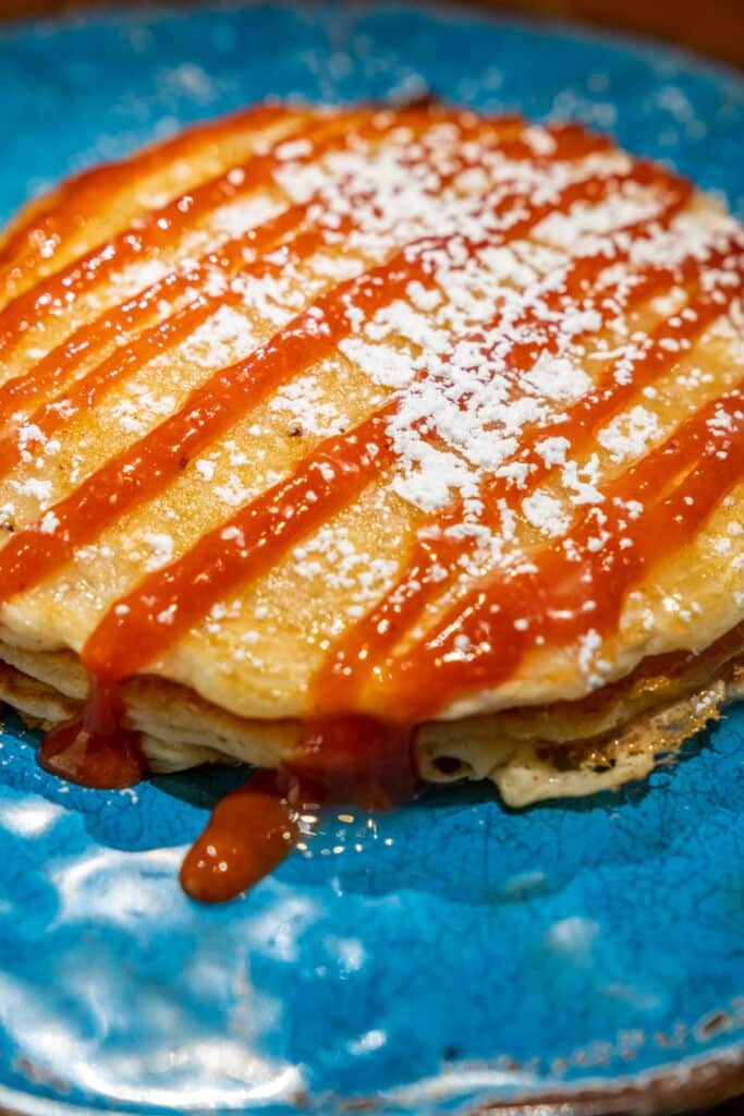 Pancakes with guava sauce and powdered sugar