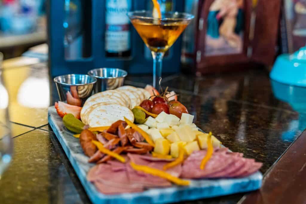 Charcuterie board with a cocktail