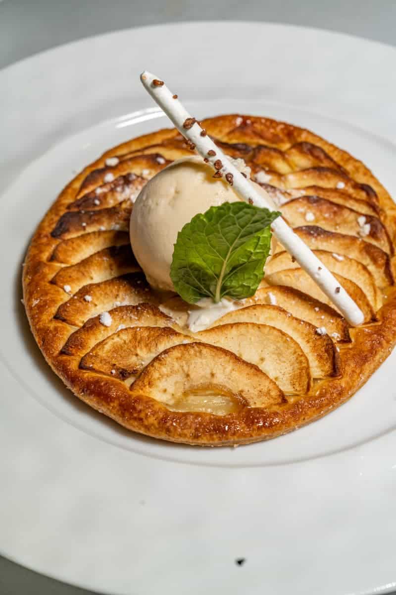 Apple dessert with a scoop of vanilla ice cream on top