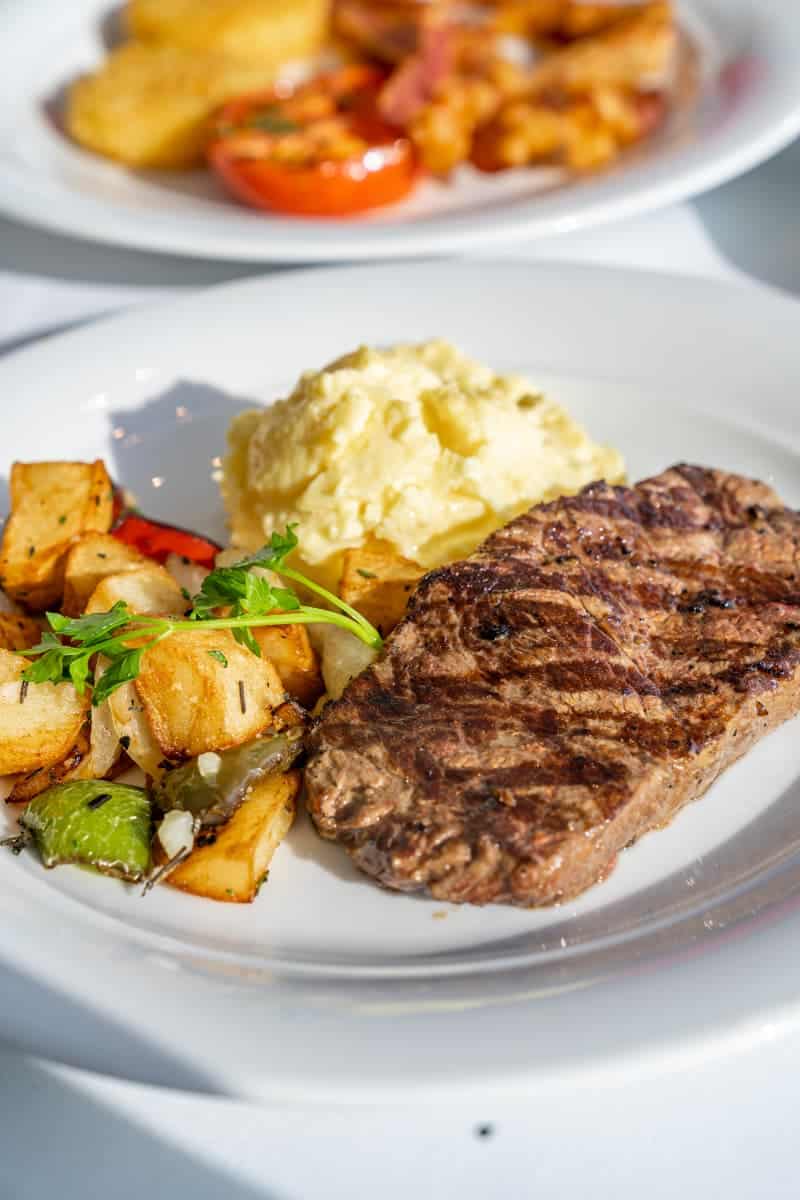 Steak and eggs with side of potatoes
