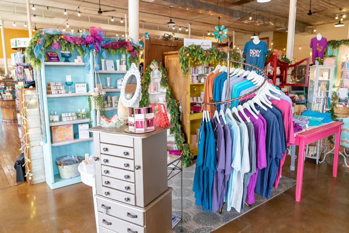 Racks of clothing and shelves of accessories inside Lady Bugs