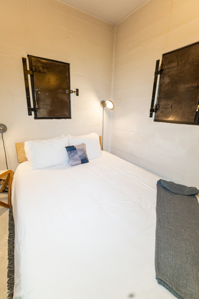 Bedroom inside one of the two jail cells