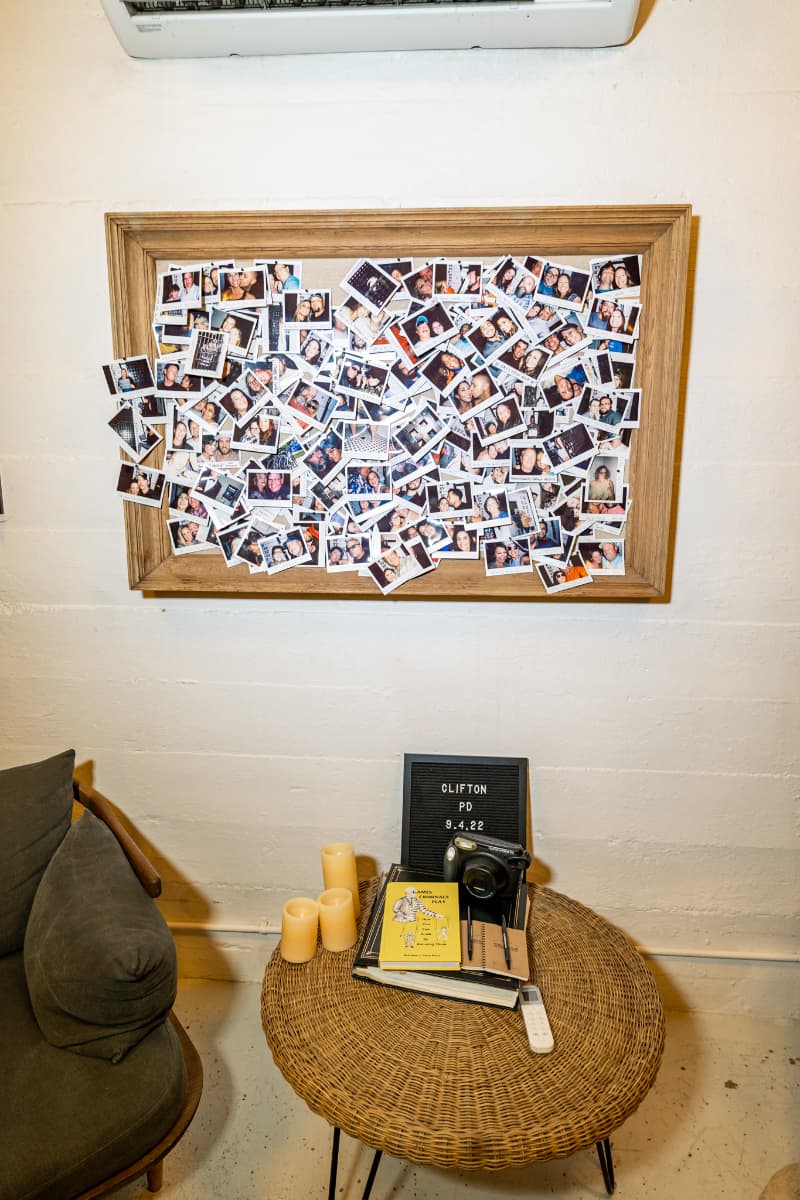 A corkboard full of polaroid pictures