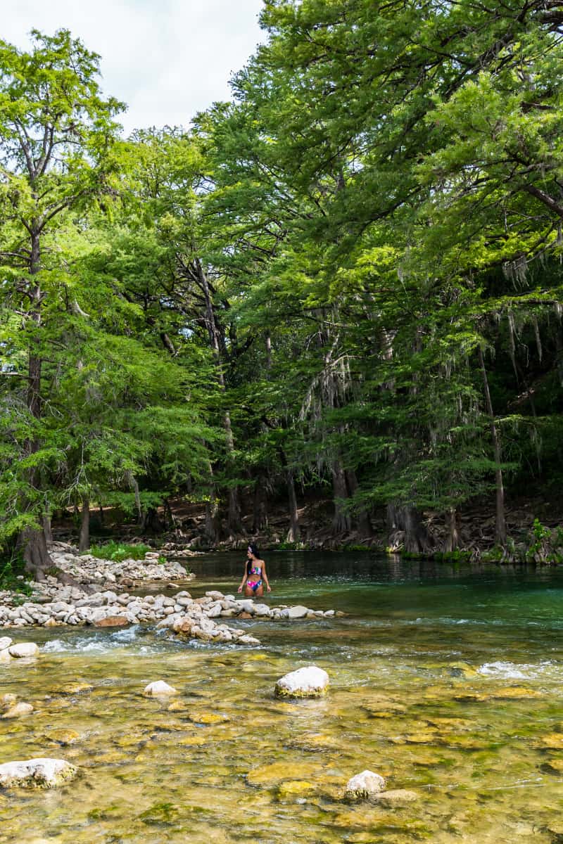 Woman standing in a river