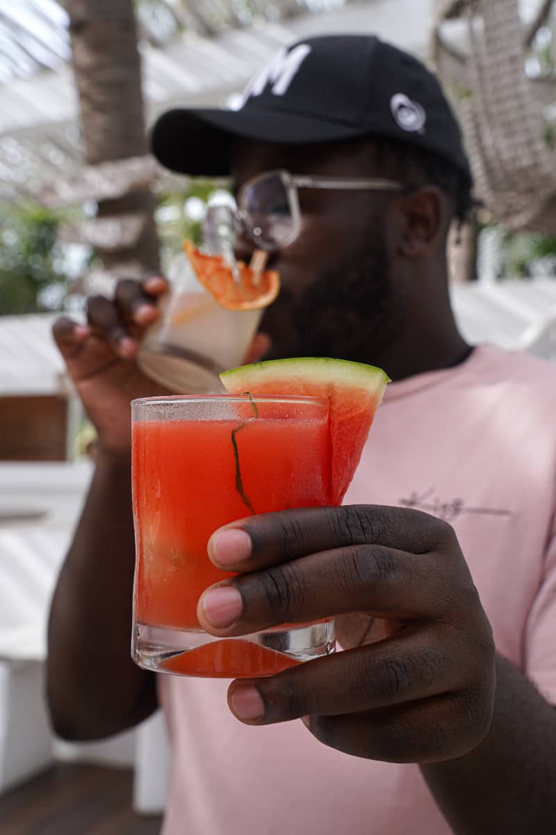 Man holding a watermelon cocktail