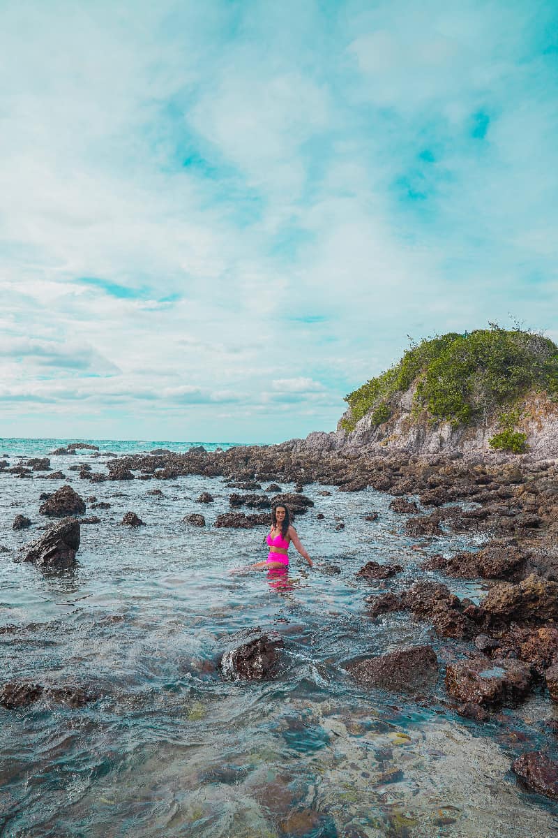 Woman wading along the shore