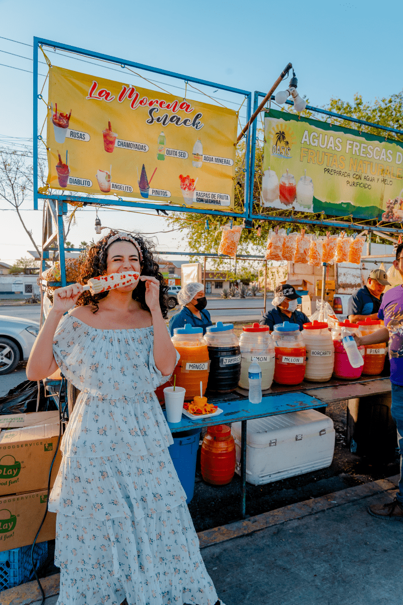 Lady eating a corn cob