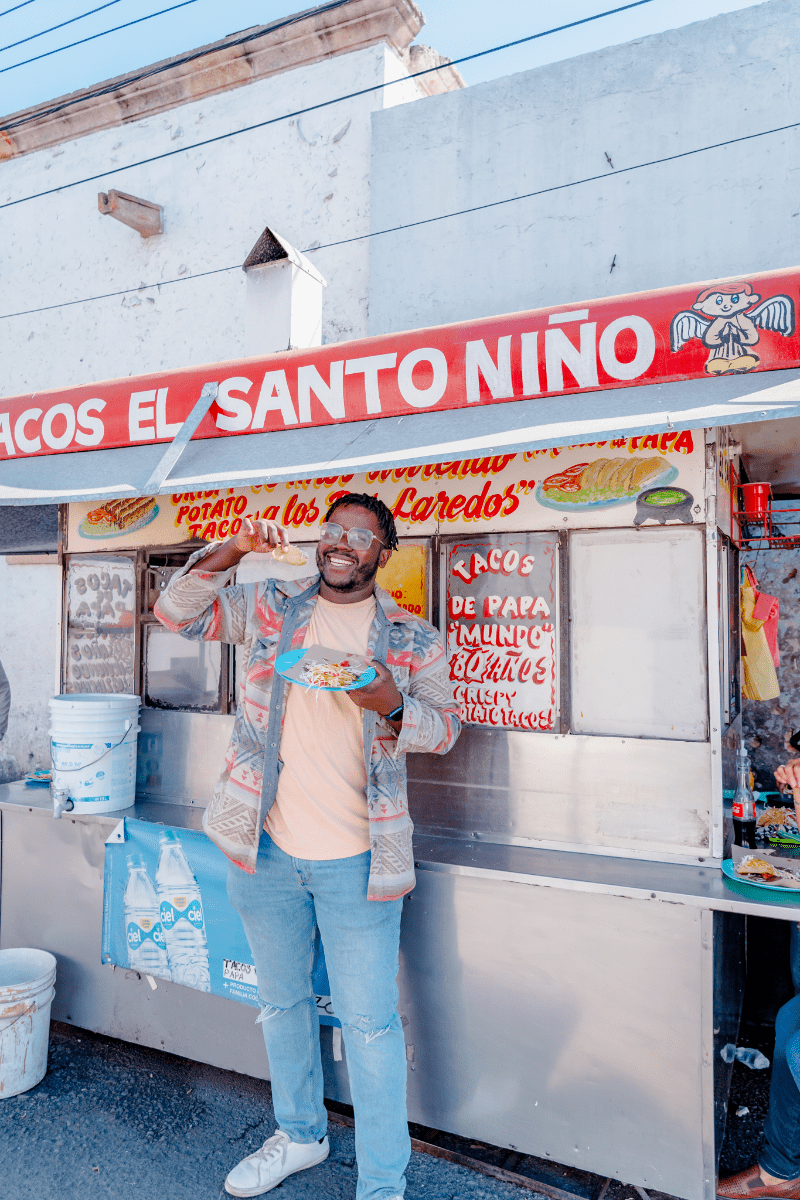 Man posing with a taco