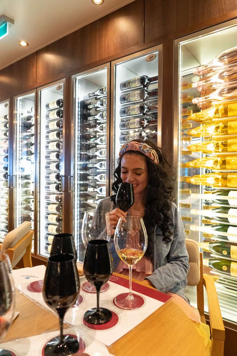 Woman sipping on a glass of wine