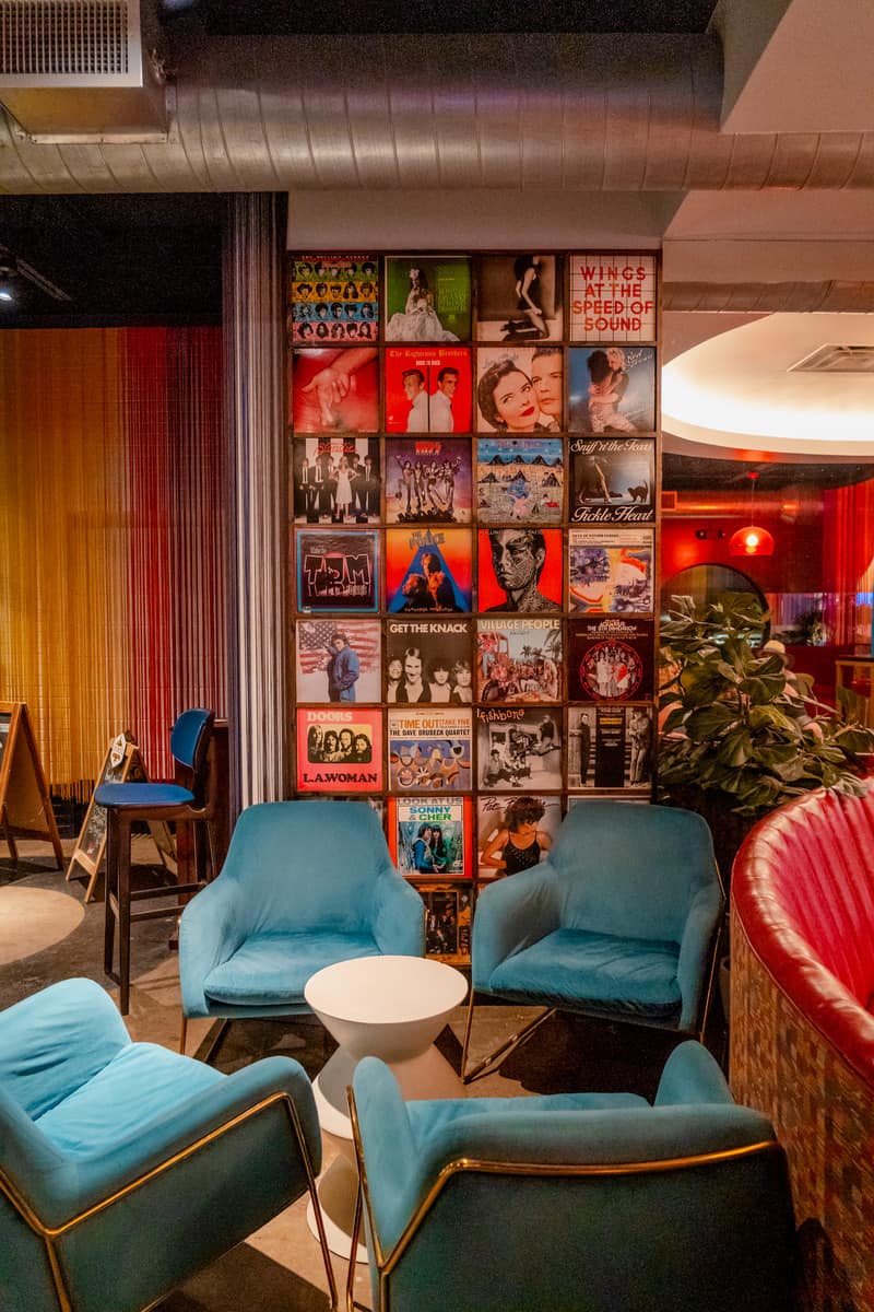 Sitting area in front of a wall of record covers