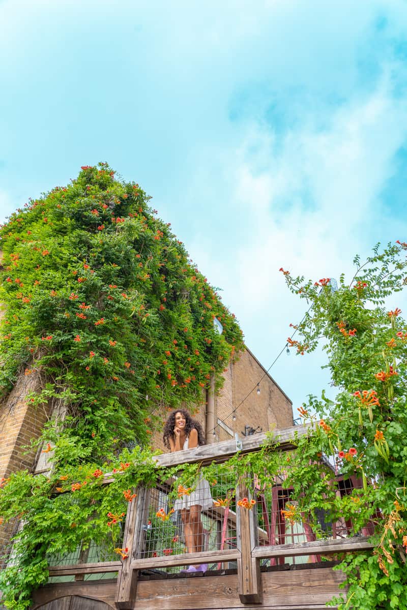 Woman looking from the second-floor balcony