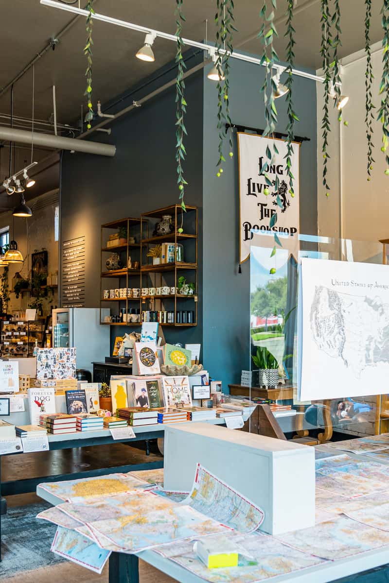 display of books, mugs, and maps