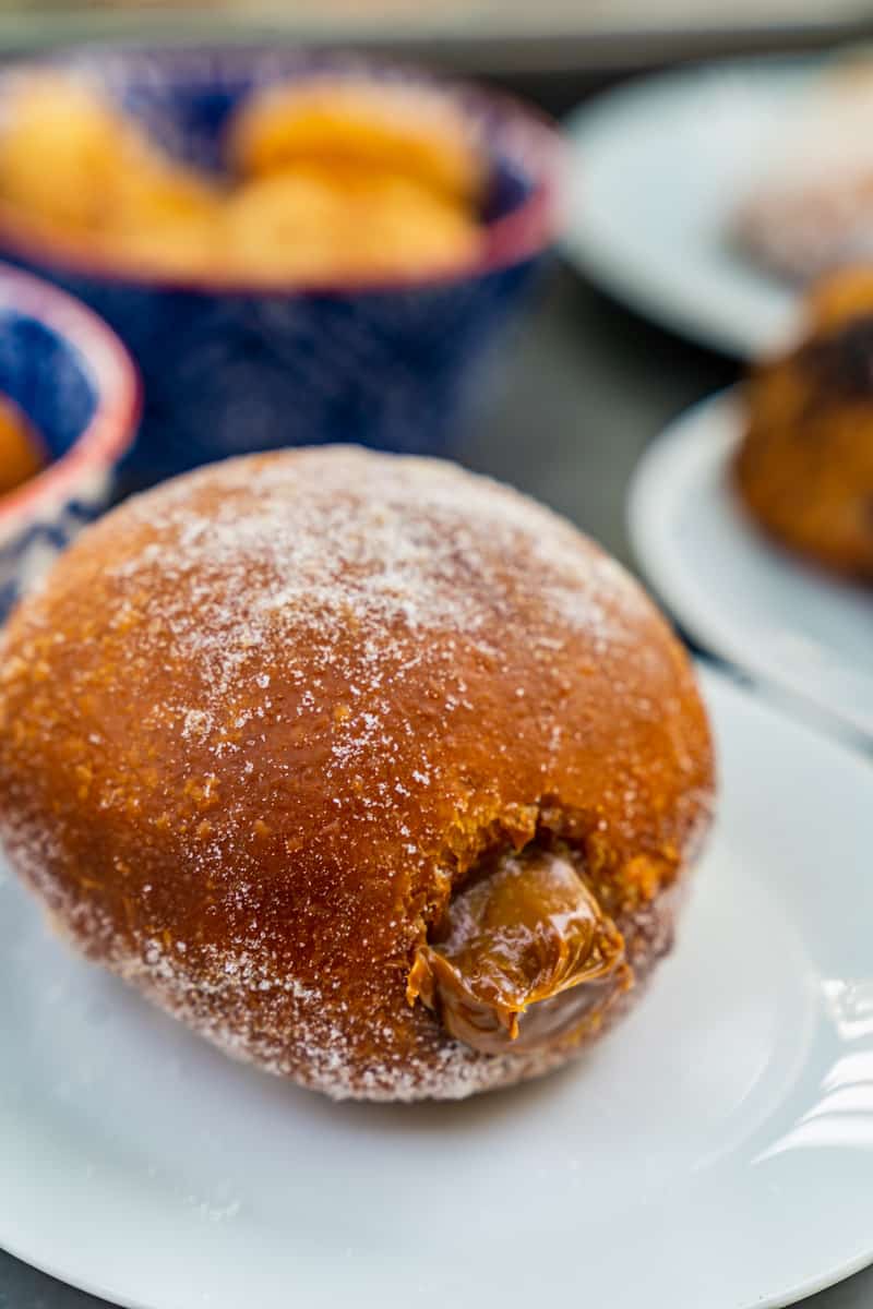 Fluffy Portuguese doughnuts filled with a luscious cream.