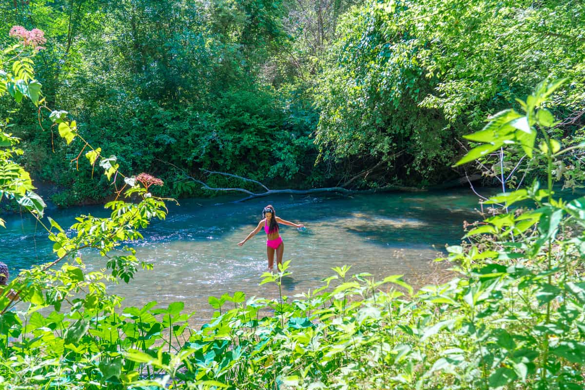 Woman wading through the water