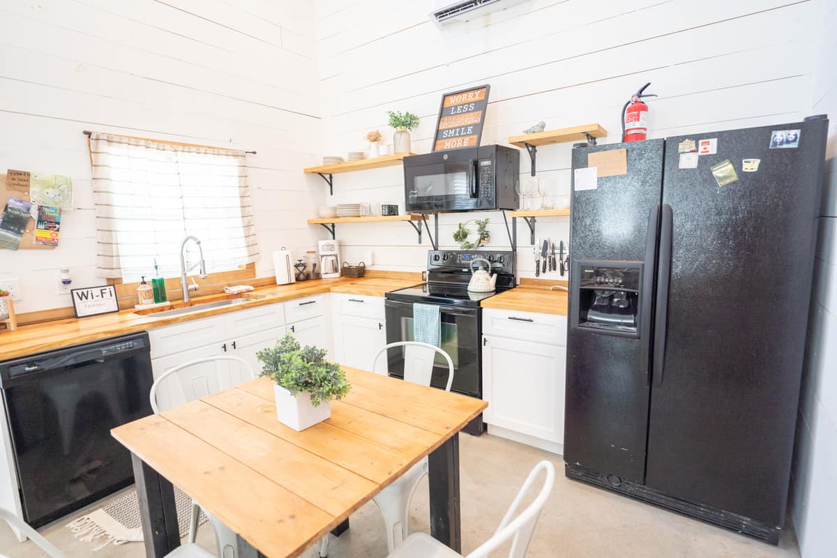 Fully furnished kitchen with four seater dining table