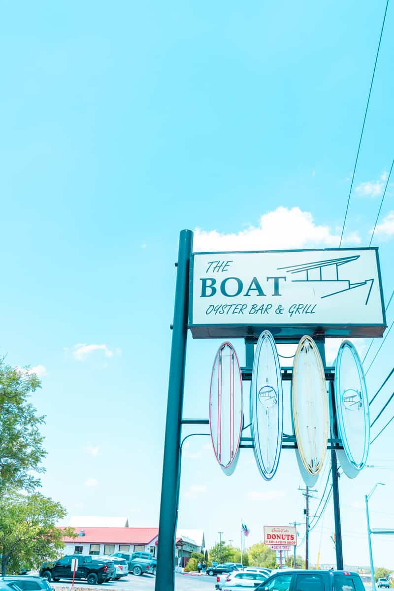 A signboard with surfboards