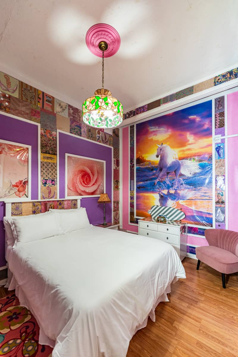 A unicorm themed room with queen size bed.