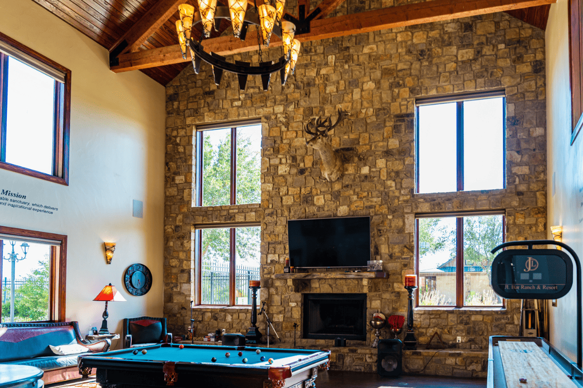 A room with pool table and wall mounted television.