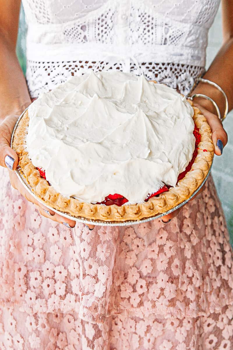 a person holding a pie