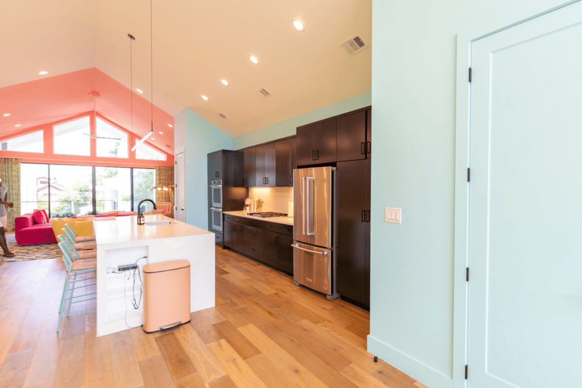 Fully furnished kitchen with island type breakfast table and kitchen sink.