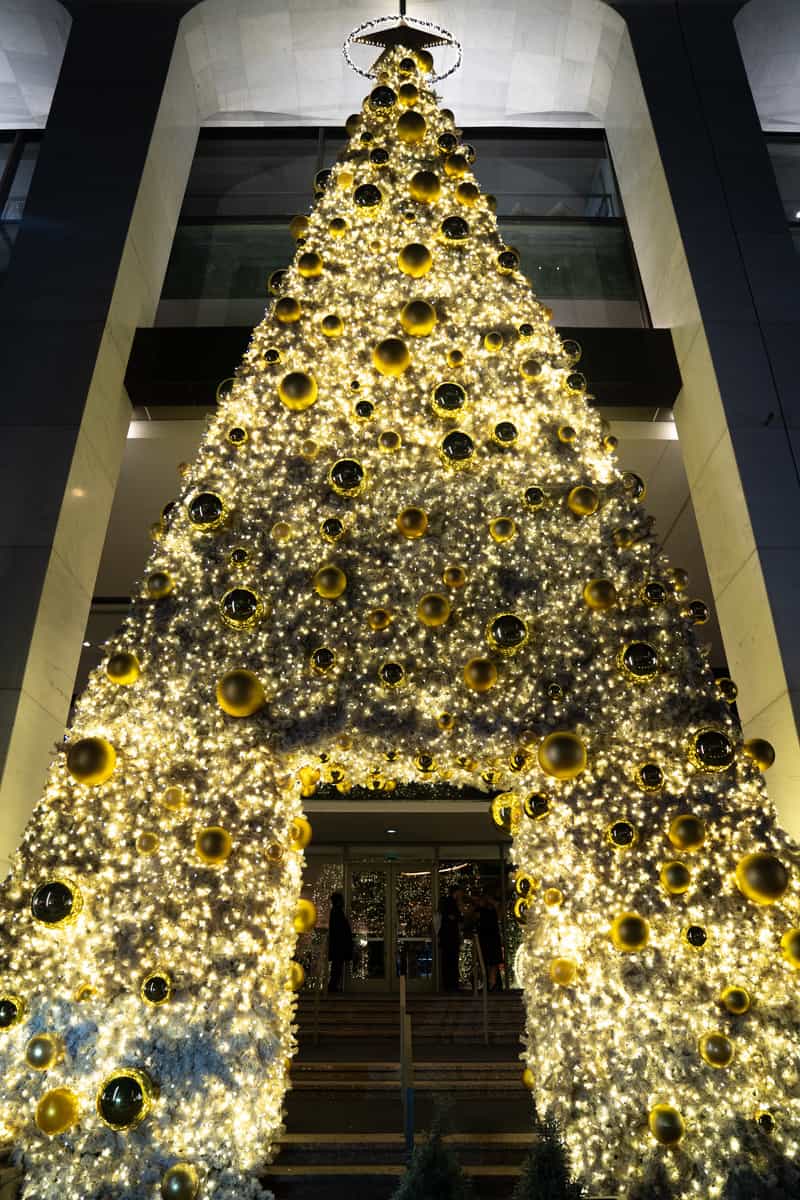 a large christmas tree made of lights and balls - Christmas bars Dallas
