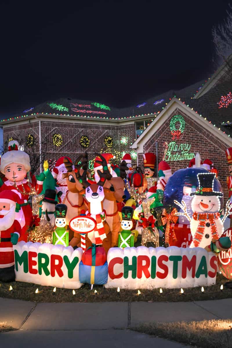 A variety of Christmas inflatables on a lawn