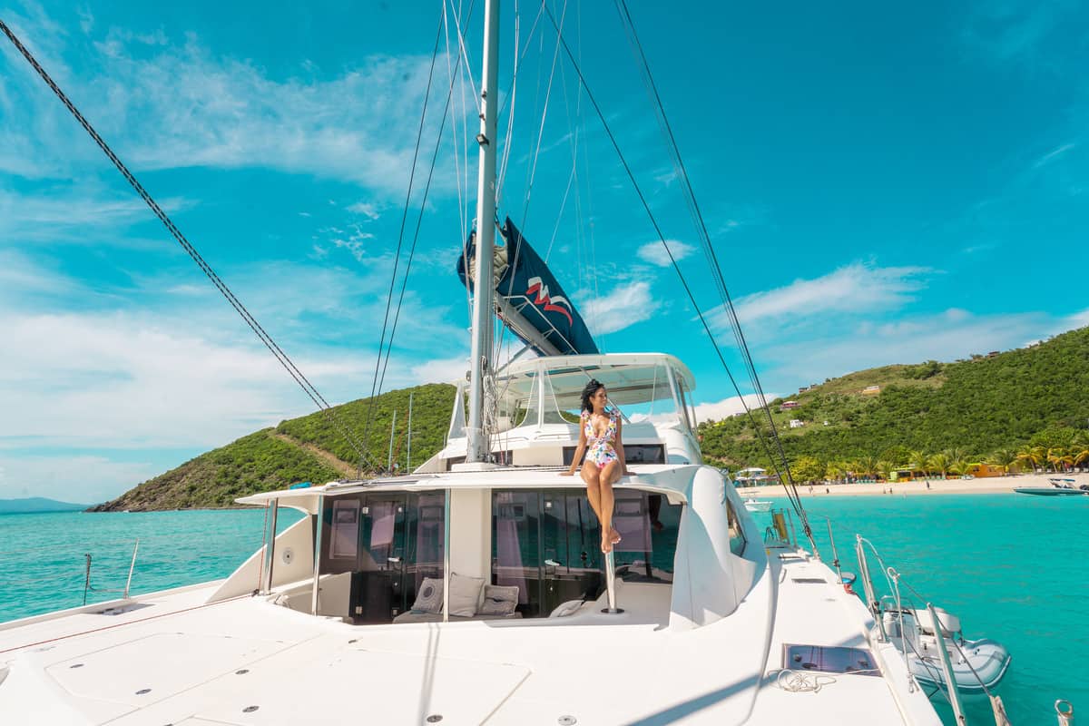 a person in a garment on a boat - british virgin islands vacation