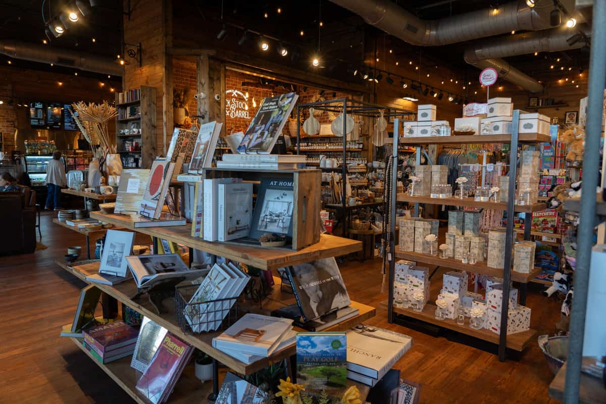 A bunch of product displays inside Cold Smoke Coffee Shop, such as books and bath products