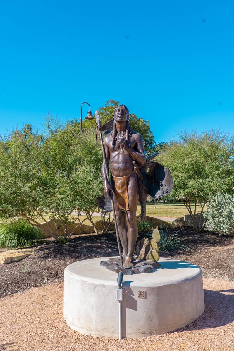 Bronze statue of a Native  American in the park