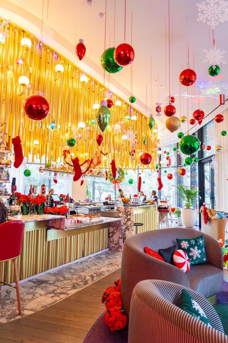 A holiday bar with festive holiday decorations in color red and gold.