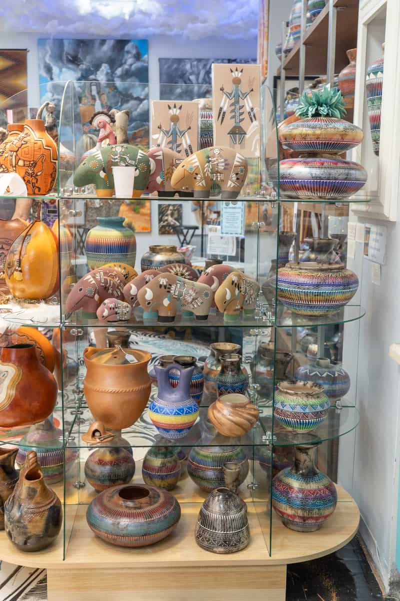 A display of colorful native-made pieces of pottery